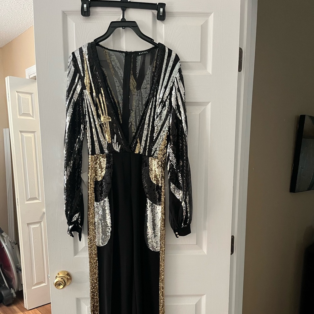 Dressy glitter trimmed jumpsuit, black size small new tags never worn